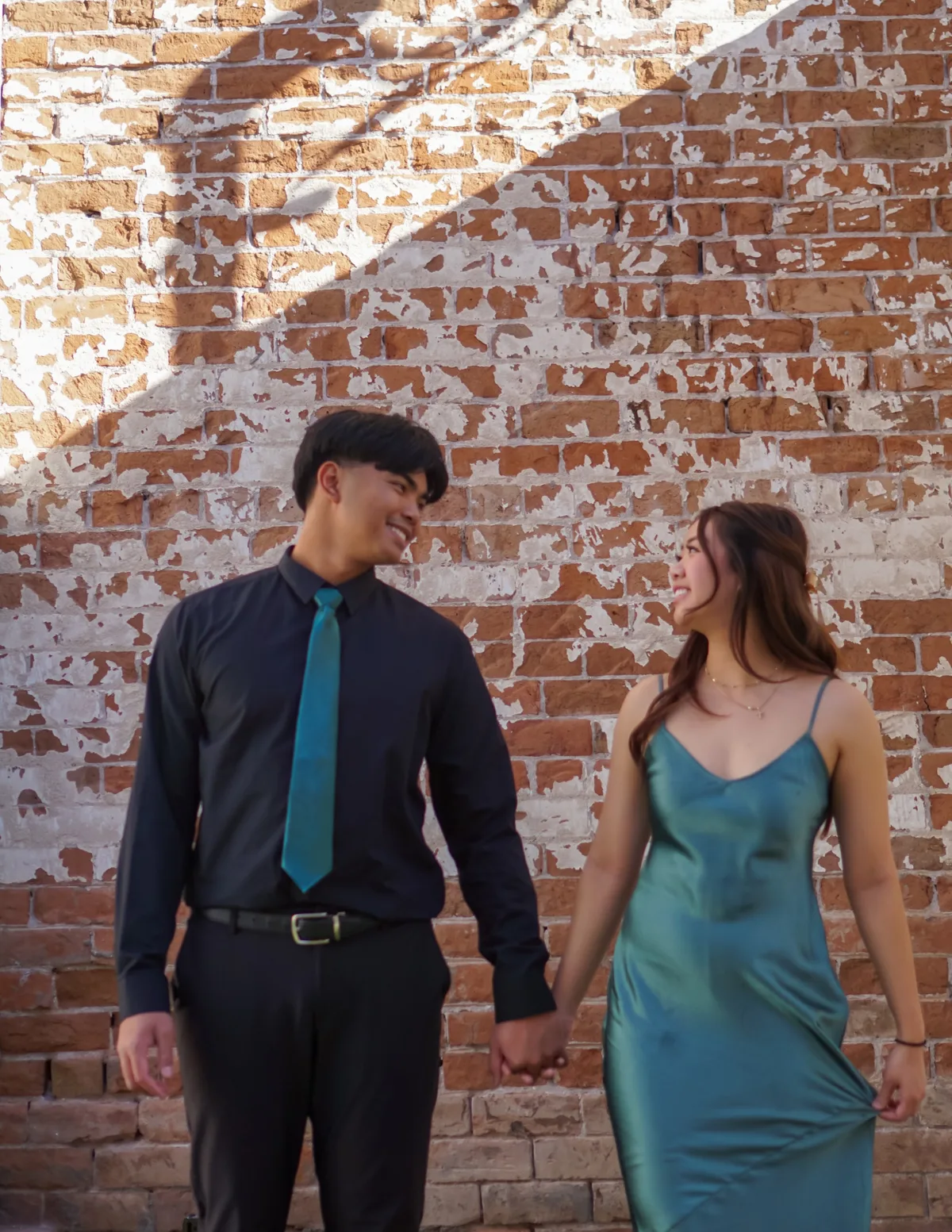 Edwin and Grace holding hands at a wedding during their early years together