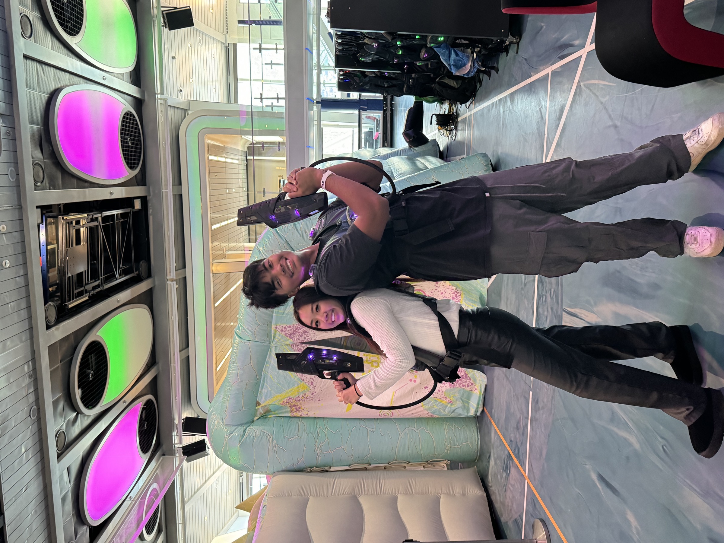 Edwin and Grace playing laser tag during their Alaska and Canada cruise